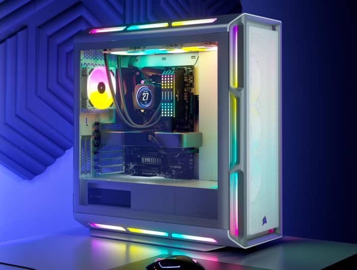 iCUE 5000T RGB Mid-Tower PC case LEDs lighting up in a desktop gaming setup showing off different colors and effects across devices